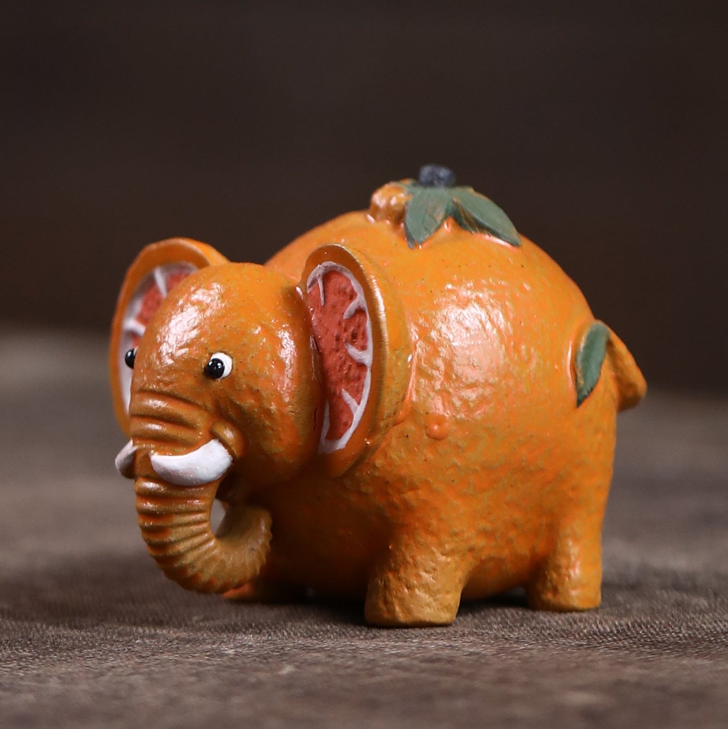 Mascottes de thé elephant orange en argile