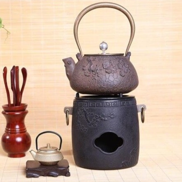 CHAUFFE THÉIÈRE EN FONTE