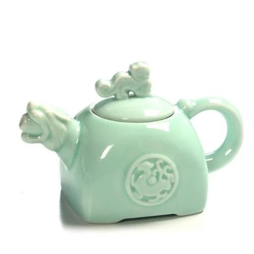 théière en céramique tigre bleu sur fond blanc