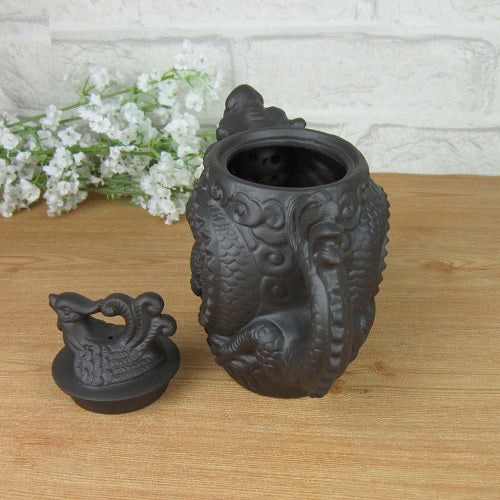 theiere en ceramique dragon assis sur table