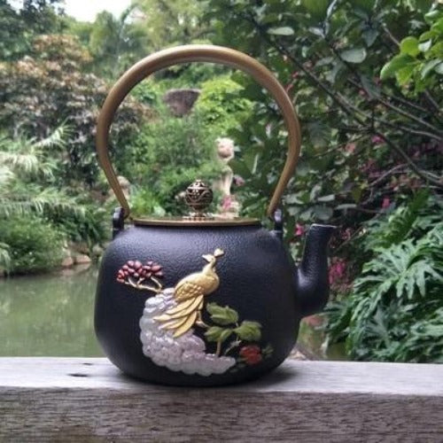 théière en fonte paon