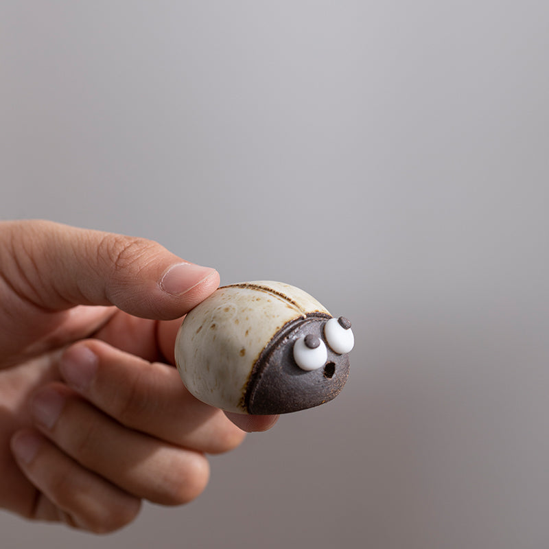 Mascottes de thé coccinelle marron