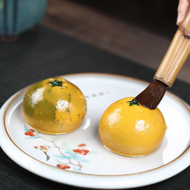 Mascottes de thé citrons en argile