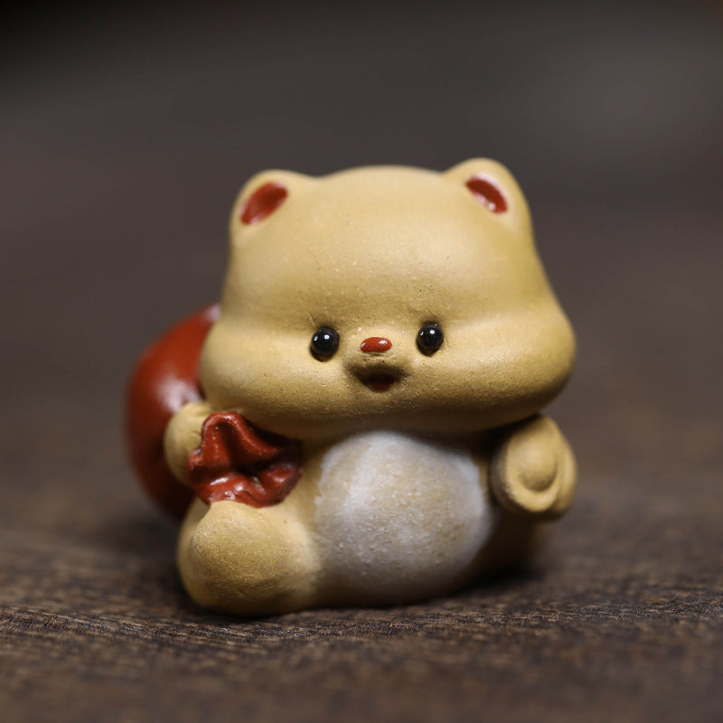 Mascottes de thé mignon en argile