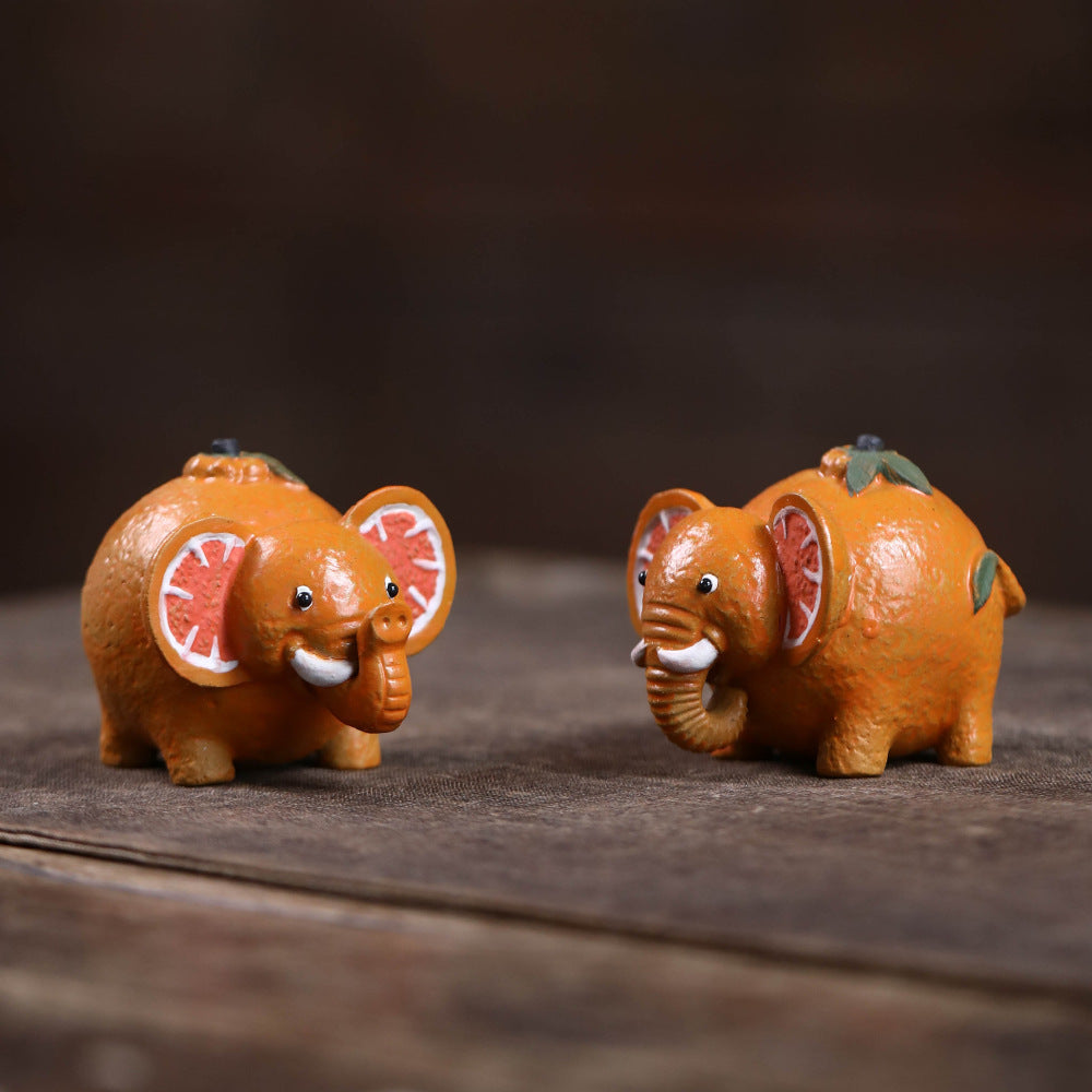 Mascottes de thé elephant orange en argile