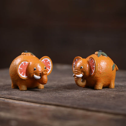 Mascottes de thé elephant orange en argile