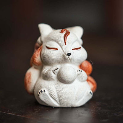 Mascottes de thé renard blanc zen