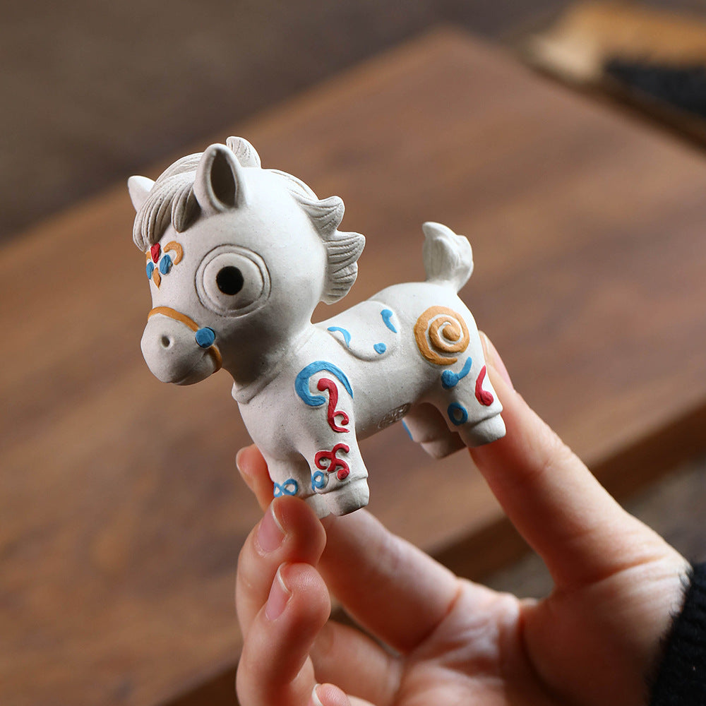 Mascottes de thé chevale blanc en argile
