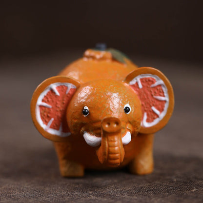 Mascottes de thé elephant orange en argile