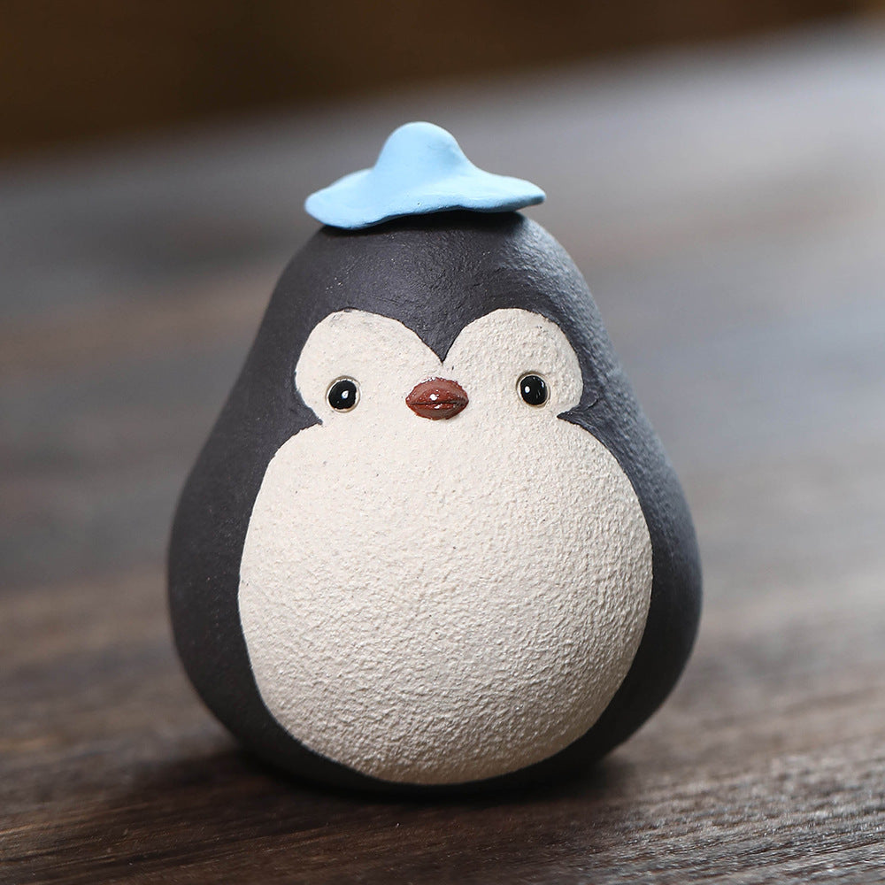 Mascottes de thé pinguin en argile