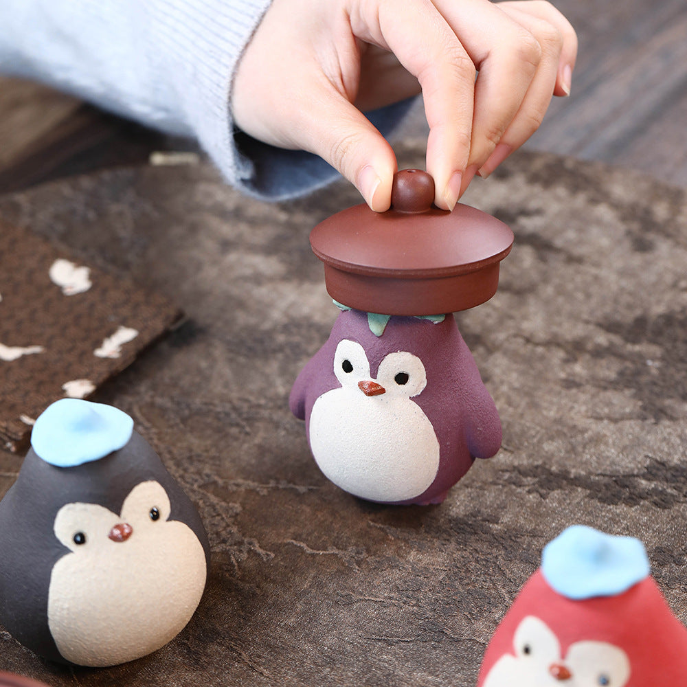 Mascottes de thé pinguin en argile