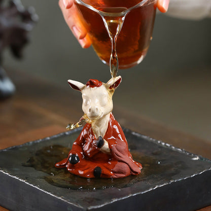 Mascottes de thé vache zen en argile