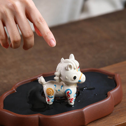 Mascottes de thé chevale blanc en argile