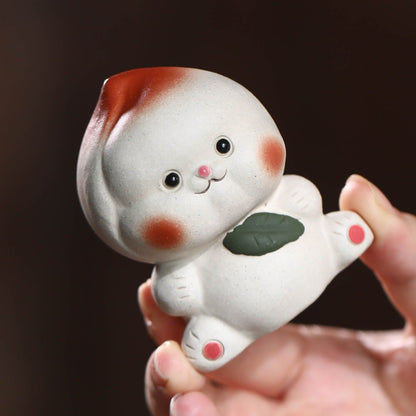 Mascottes de thé plum en argile
