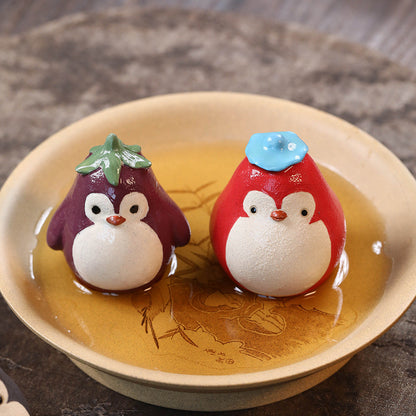 Mascottes de thé pinguin en argile