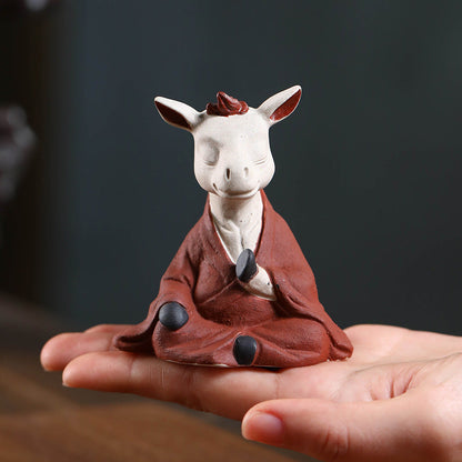 Mascottes de thé vache zen en argile
