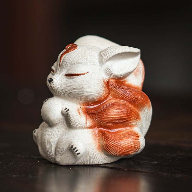 Mascottes de thé renard blanc zen