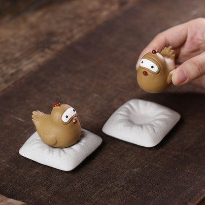 Mascottes de thé coque en argile