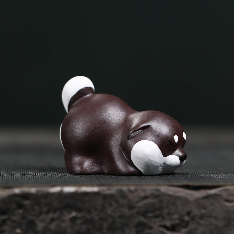 Mascottes de thé chien dormant en argile
