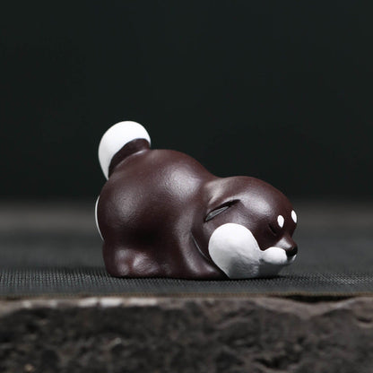 Mascottes de thé chien dormant en argile