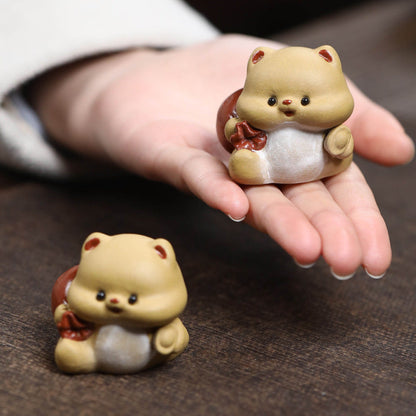 Mascottes de thé mignon en argile
