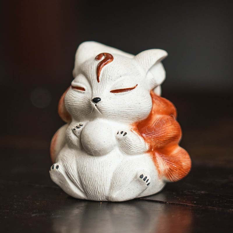 Mascottes de thé renard blanc zen