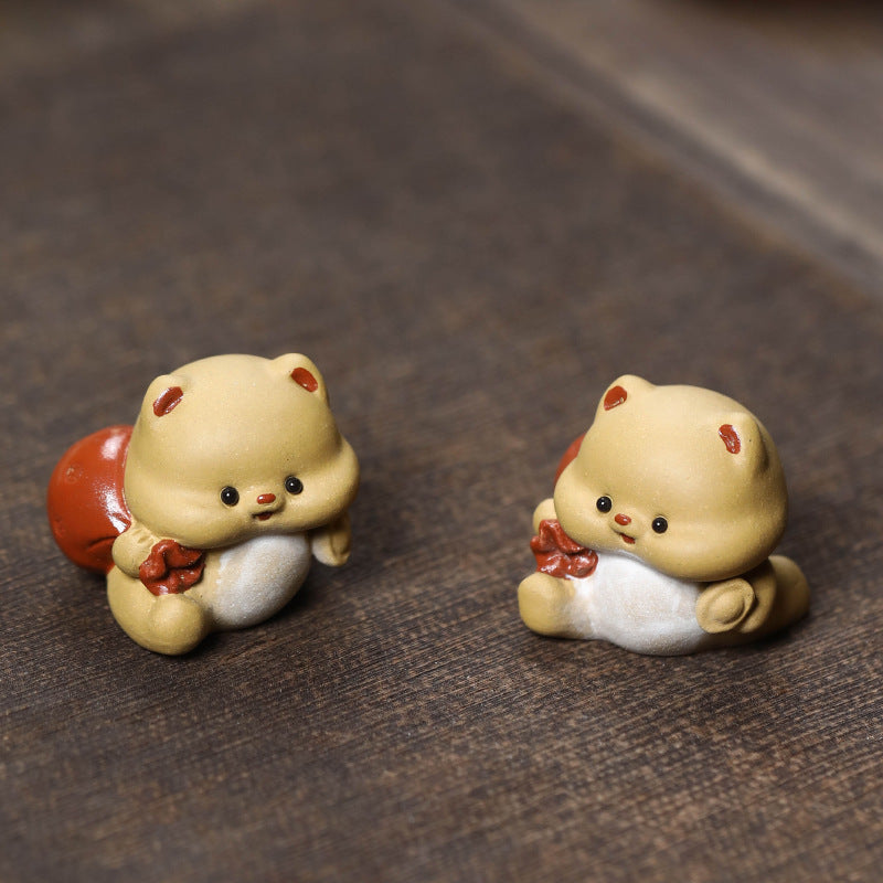 Mascottes de thé mignon en argile