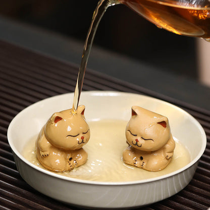 Mascottes de thé chat dormant en argile