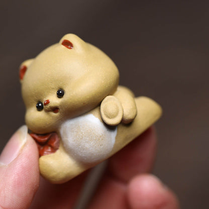 Mascottes de thé mignon en argile