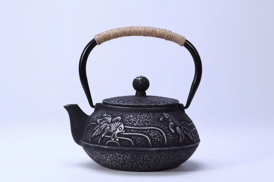 THÉIÈRE EN FONTE  POISSONS